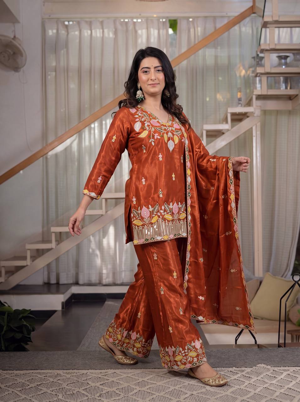 Elegant Rust Orange Silk Kurta and Flared Palazzo Set Adorned with Intricate Multicolored Botanical Embroidery and Mirror Work